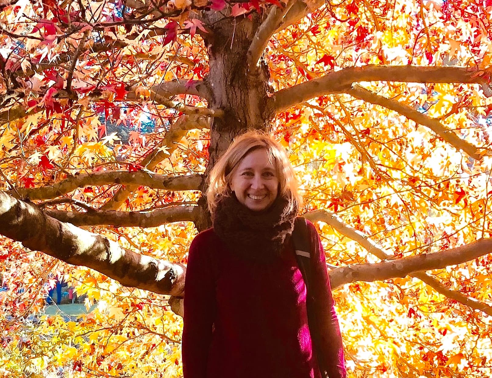 Laura amid autumn foliage